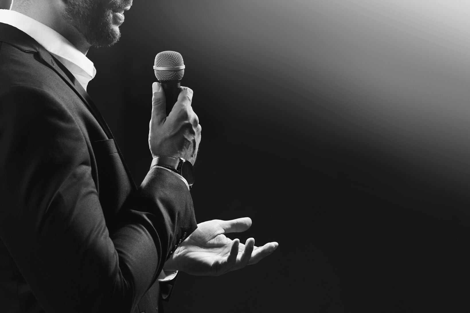 Motivational Speaker with Microphone Performing on Stage, Closeu